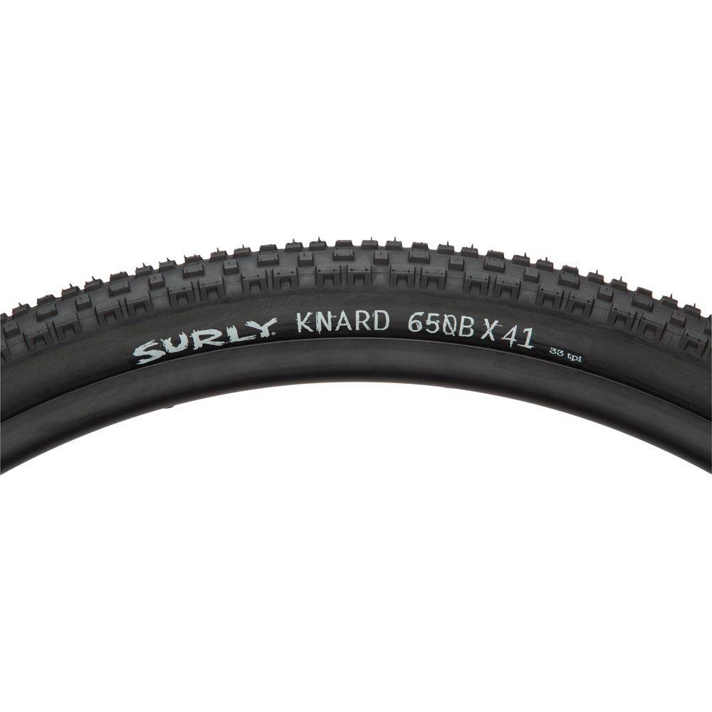 Surly Knard 650b tubeless-ready mountain bike tyre with knobby tread for hardpack and groomed trail riding, close-up view.