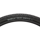 Surly Knard 650b tubeless-ready mountain bike tyre with knobby tread for hardpack and groomed trail riding, close-up view.