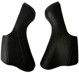 Pair of Shimano Dura-Ace ST-9100 bracket covers for shifter protection and replacement, shown in close-up view.