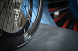 DT Swiss ARC 1400 DICUT rear carbon clincher wheel with 38x20mm rim, showcasing aerodynamic design and high-performance cycling components.
