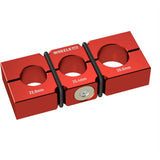 Wheels Manufacturing large shaft clamp set for suspension components, 23.8-28.6mm, shown in a workshop setting.