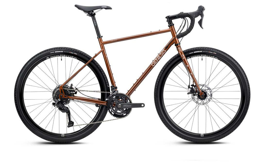 Genesis Croix de Fer 10 gravel bike with Shimano 2x9-speed drivetrain, featuring lightweight frame and rugged tires for versatile off-road riding.