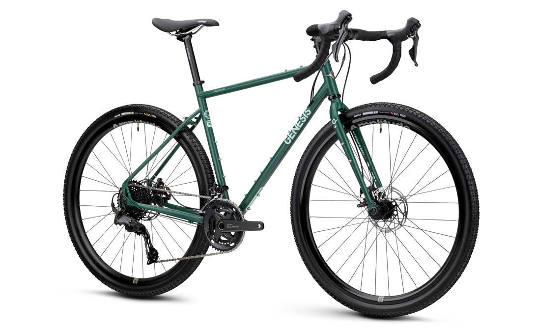 Genesis Croix de Fer 20 gravel bike featuring Shimano 2x10-speed drivetrain and TRP Spyre disc brakes, shown on a scenic trail.