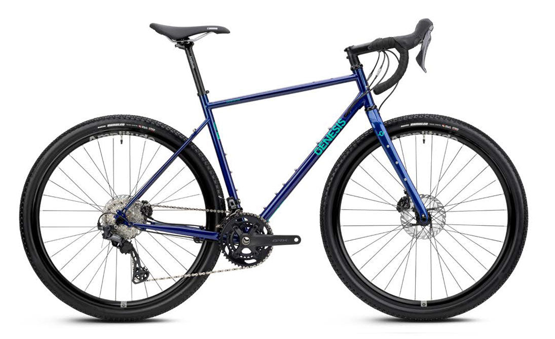 Genesis Croix de Fer 50 gravel bike with Shimano GRX 2x12-speed drivetrain and hydraulic brakes, shown from the side.
