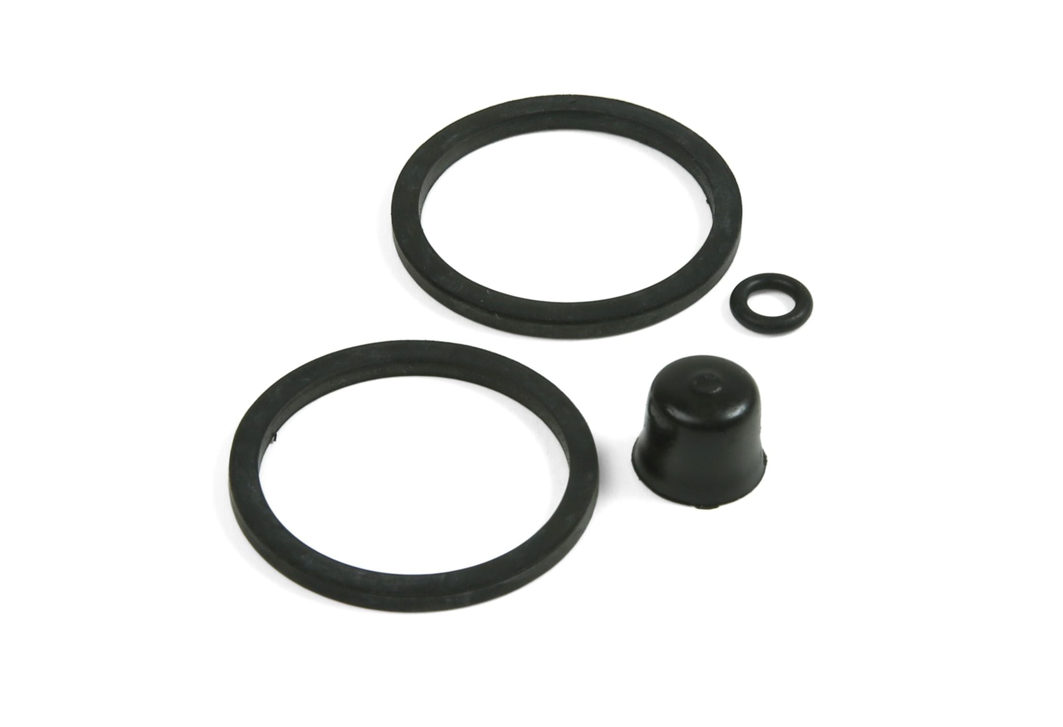 Hope E4 caliper seal kit replacement components for brake maintenance, showing seals and spare parts on a clean surface.