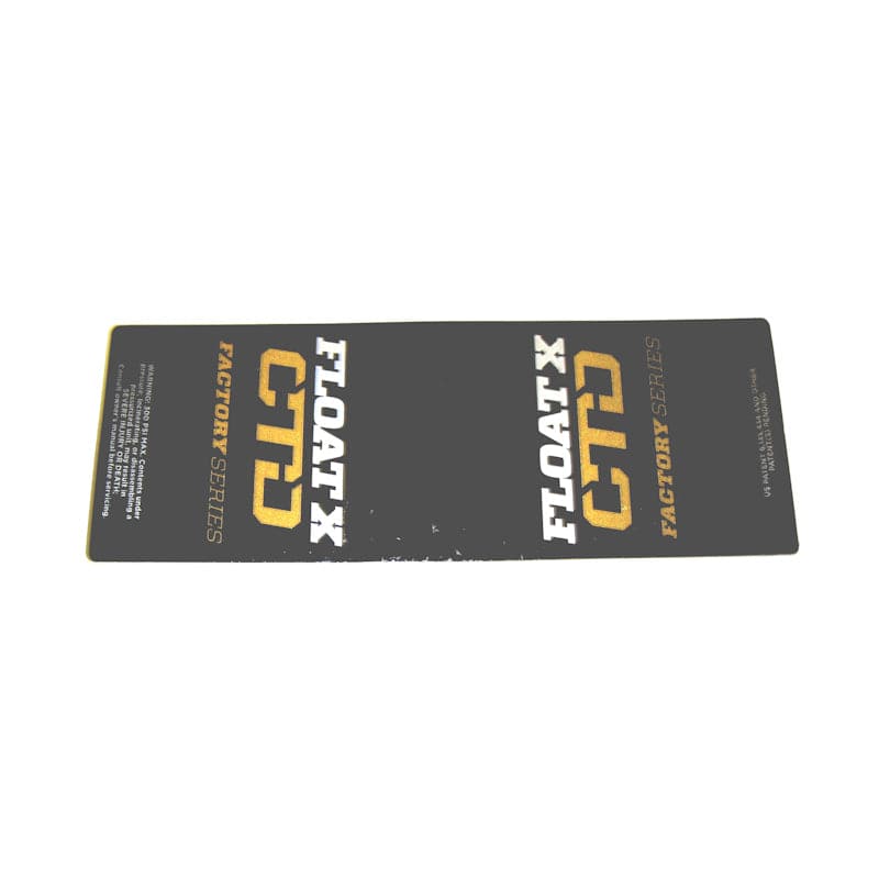 Fox Shock FLOAT X CTD LV 2014 gold decal replacement sticker on rear shock component, featuring vibrant gold design.
