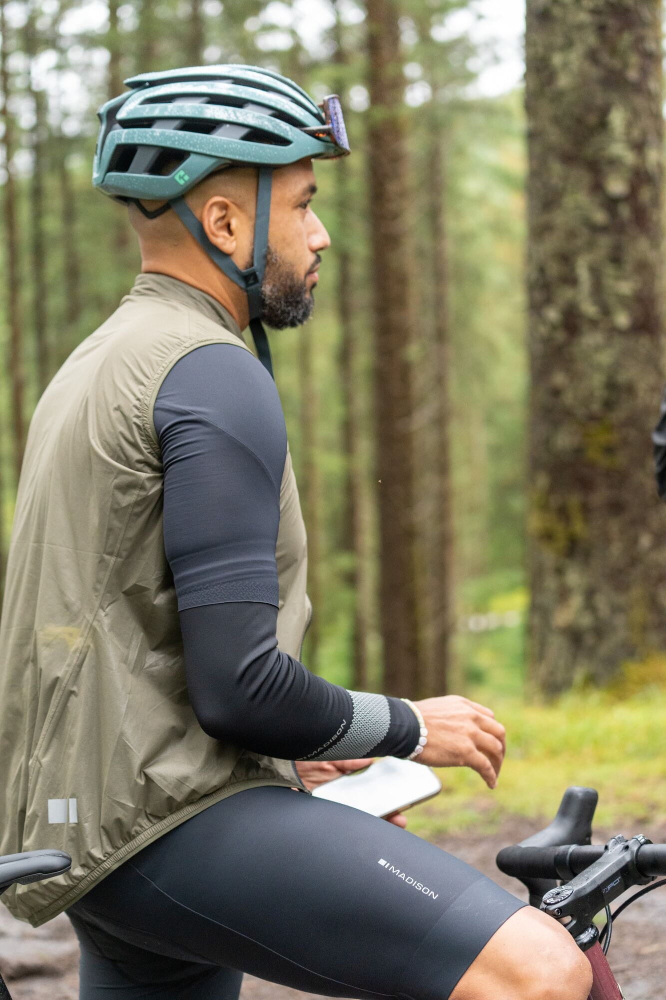 Madison Flux 2L Ultra Packable Waterproof Men's Cycling Gilet with reflective inserts, shown folded and laid flat.
