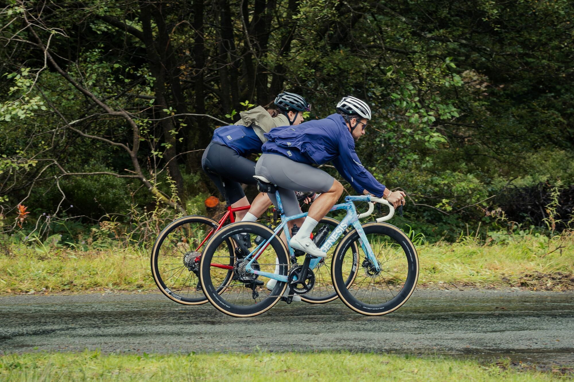 Madison men's windproof packable cycling jacket with ventilation technology, shown folded and partially worn, ideal for outdoor riding.