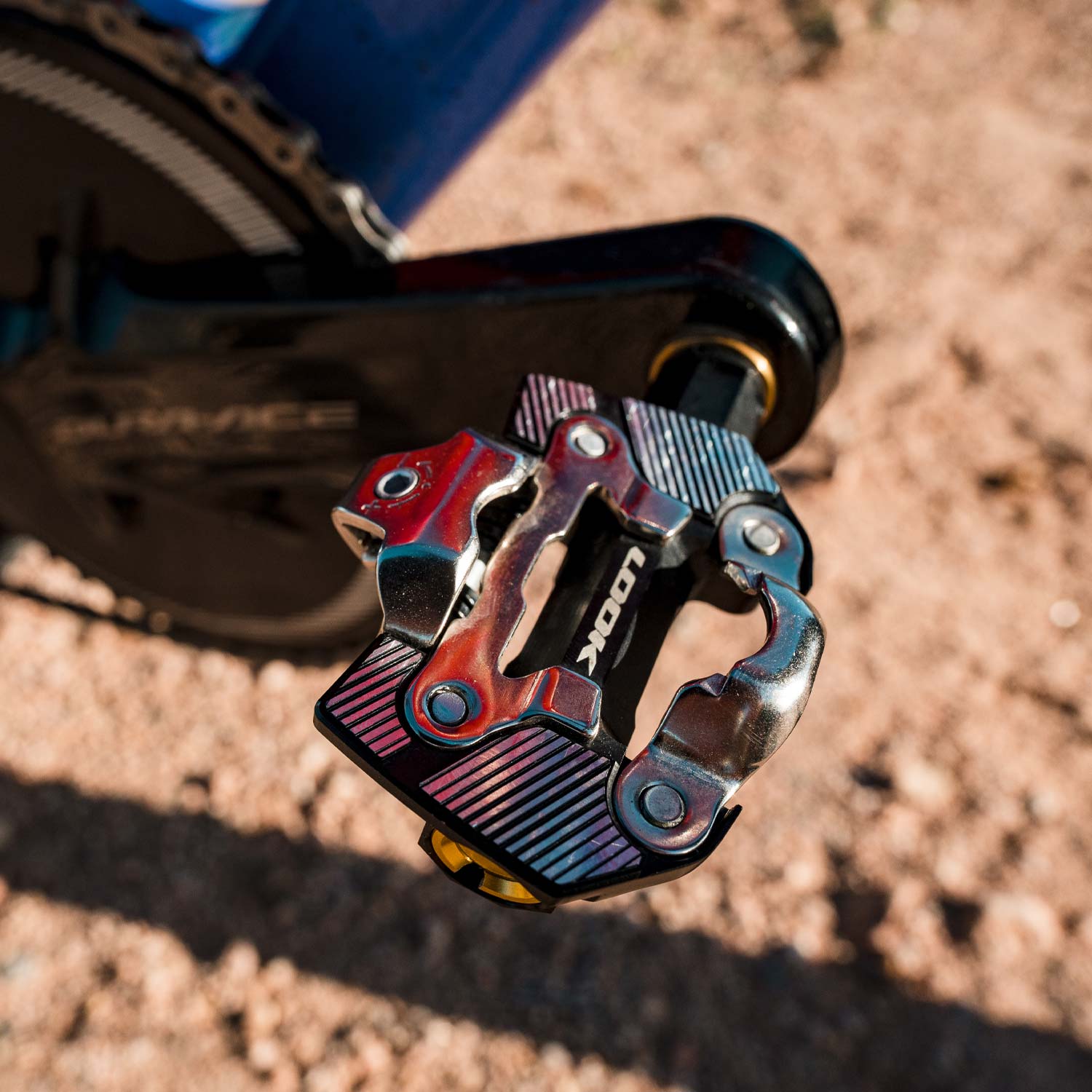 Look X-One-G Ti gravel racing pedals with SPD compatibility and adjustable tension, shown with metal cleats and pedal body.