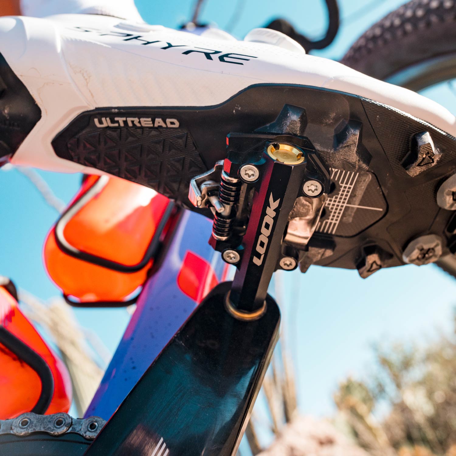 Look X-One-G Ti gravel racing pedals with SPD compatibility and adjustable tension, showing the lightweight titanium design and pedal cleats.