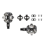 Look X-Track MTB pedals in dark grey with SPD compatibility, off-road bike components designed for secure pedal engagement.