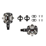 Look X-Track Race Carbon MTB pedals with SPD clipless mechanism and 60mm platform, shown with cleats attached on black pedals.