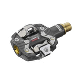 Look X-Track Race Carbon Ti MTB pedals with adjustable SPD cleats, lightweight carbon and titanium construction for mountain biking.