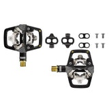 Look X-Track EN-Rage Plus TI MTB pedals with titanium axle and SPD compatibility, shown mounted on a mountain bike crank.