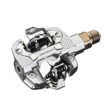 Look X-Track Power single MTB and gravel pedal with integrated power meter, showing the pedal's design and cleat attachment.