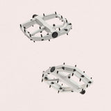 Look Trail Roc Plus flat pedals with forged aluminum platform and adjustable pins, designed for cycling components.