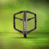 Look Trail Roc flat mountain bike pedals with traction pins, durable components designed for off-road cycling.