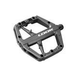 Look Trail Roc flat pedals with traction pins for mountain biking, featuring durable components and a rugged design for off-road riding.