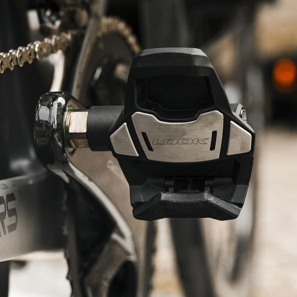 Look Keo Blade Power dual pedals with integrated power meter and Bluetooth connectivity, showing sleek pedal design and digital display.