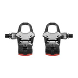 Look Keo 2 Max Vision Black pedals with integrated safety lights and USB-C rechargeable system, showing sleek design and clipless mechanism.
