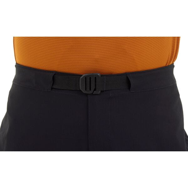 Madison Freewheel Men's Trousers in dark fabric, showing front and side view with belt loops and tailored fit.