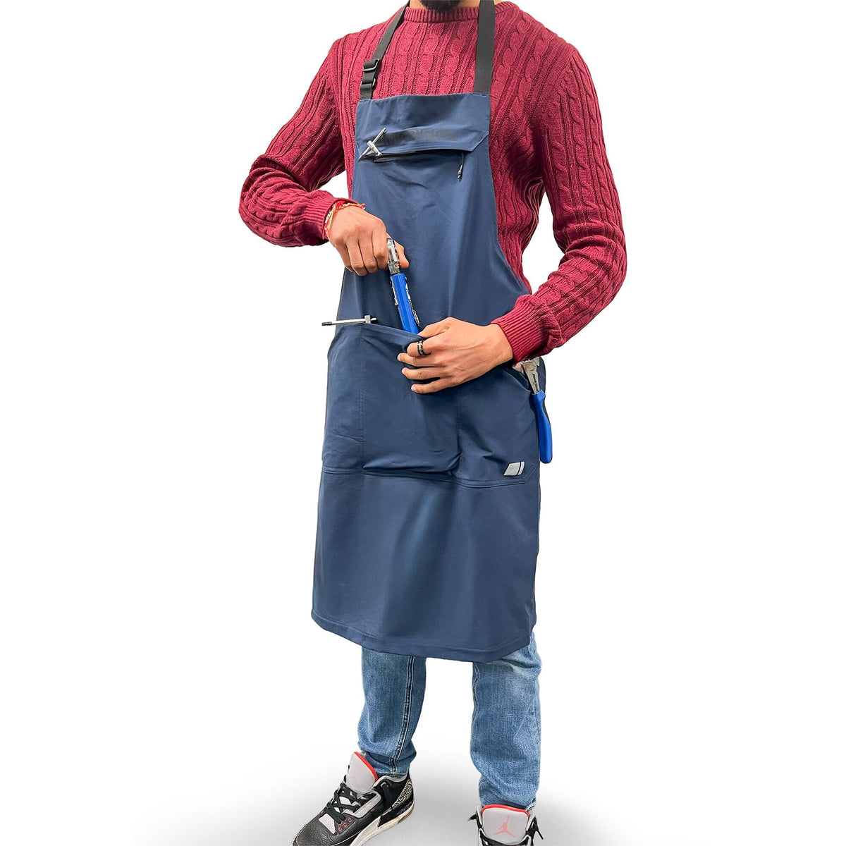 Madison Roam Blue Workshop Apron with adjustable waist and multiple tool pockets, ideal for woodworking and DIY projects.