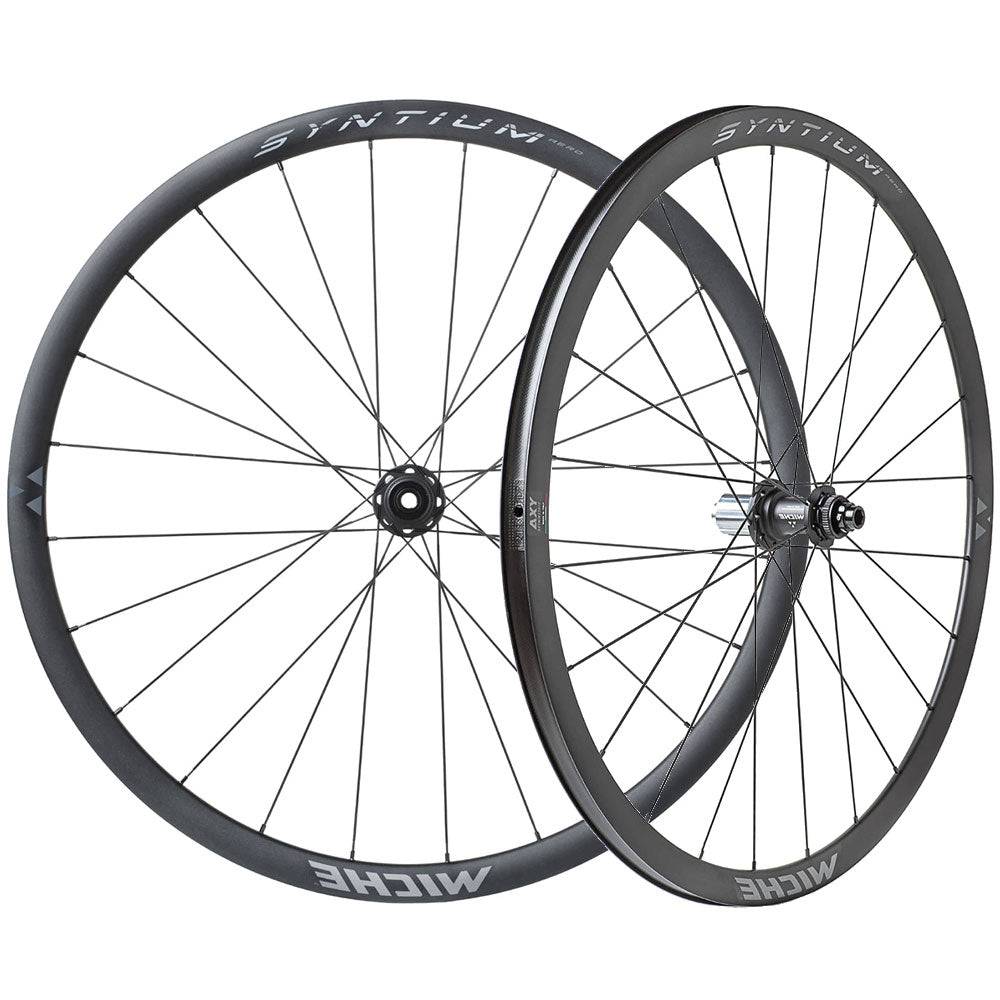 Miche Syntium Aero road wheelset with asymmetric 29mm tubeless-ready wheels, showcasing lightweight carbon rims and high-performance components.
