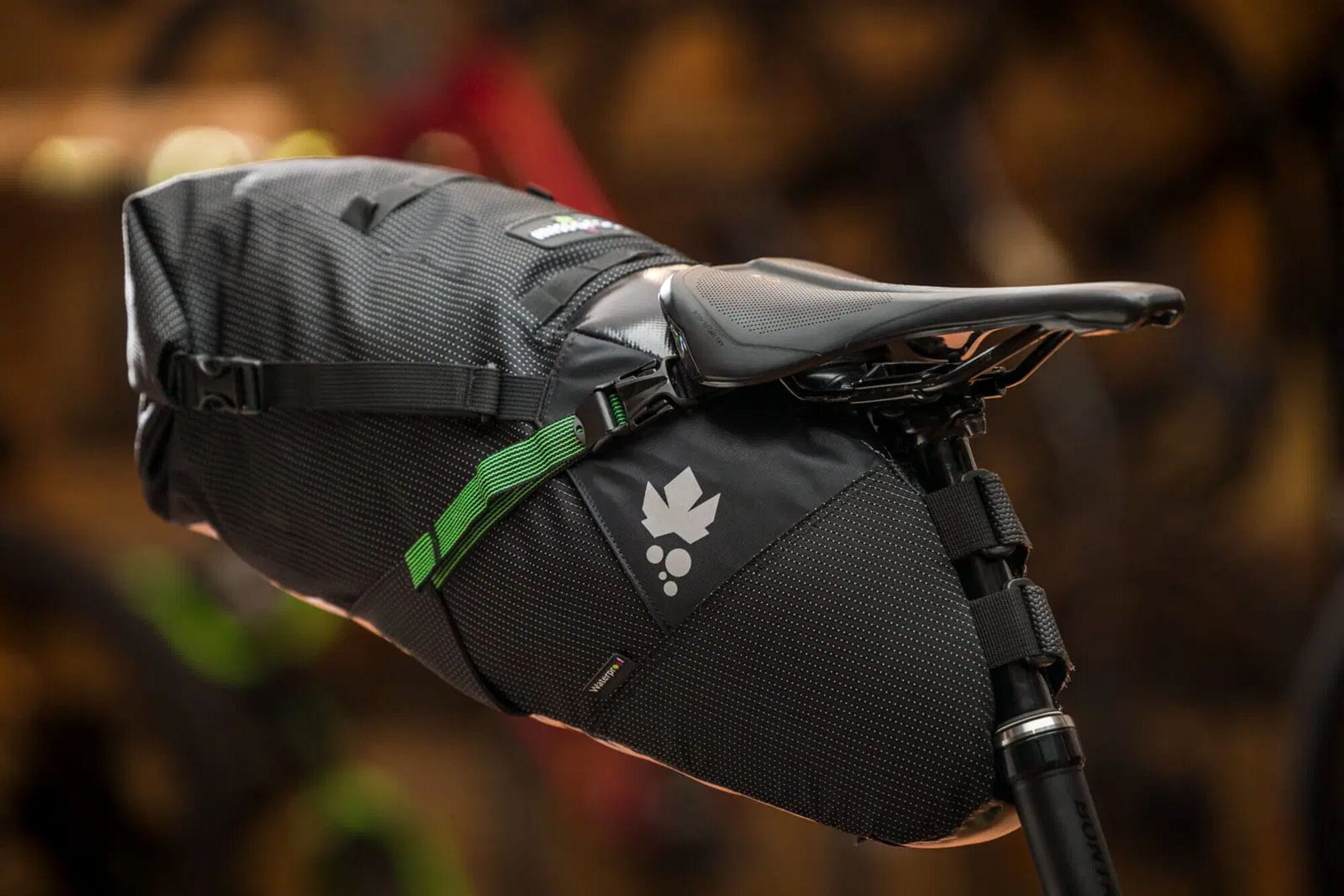 Miss Grape Cluster 20 Adventure waterproof saddle bag mounted on bike, designed for bikepacking with durable, compact storage.