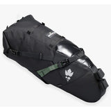 Miss Grape Cluster 20 Adventure waterproof saddle bag attached to bike saddle for bikepacking, featuring durable outdoor gear design.
