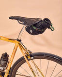 Miss Grape Cluster 2 Road waterproof saddle bag mounted on bike, compact cycling accessory with 2-liter capacity for essentials.