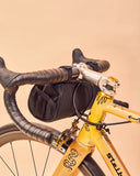 Miss Grape Moon Commute handlebar bag for road and gravel bikes, water-resistant cycling accessory with secure mounting.
