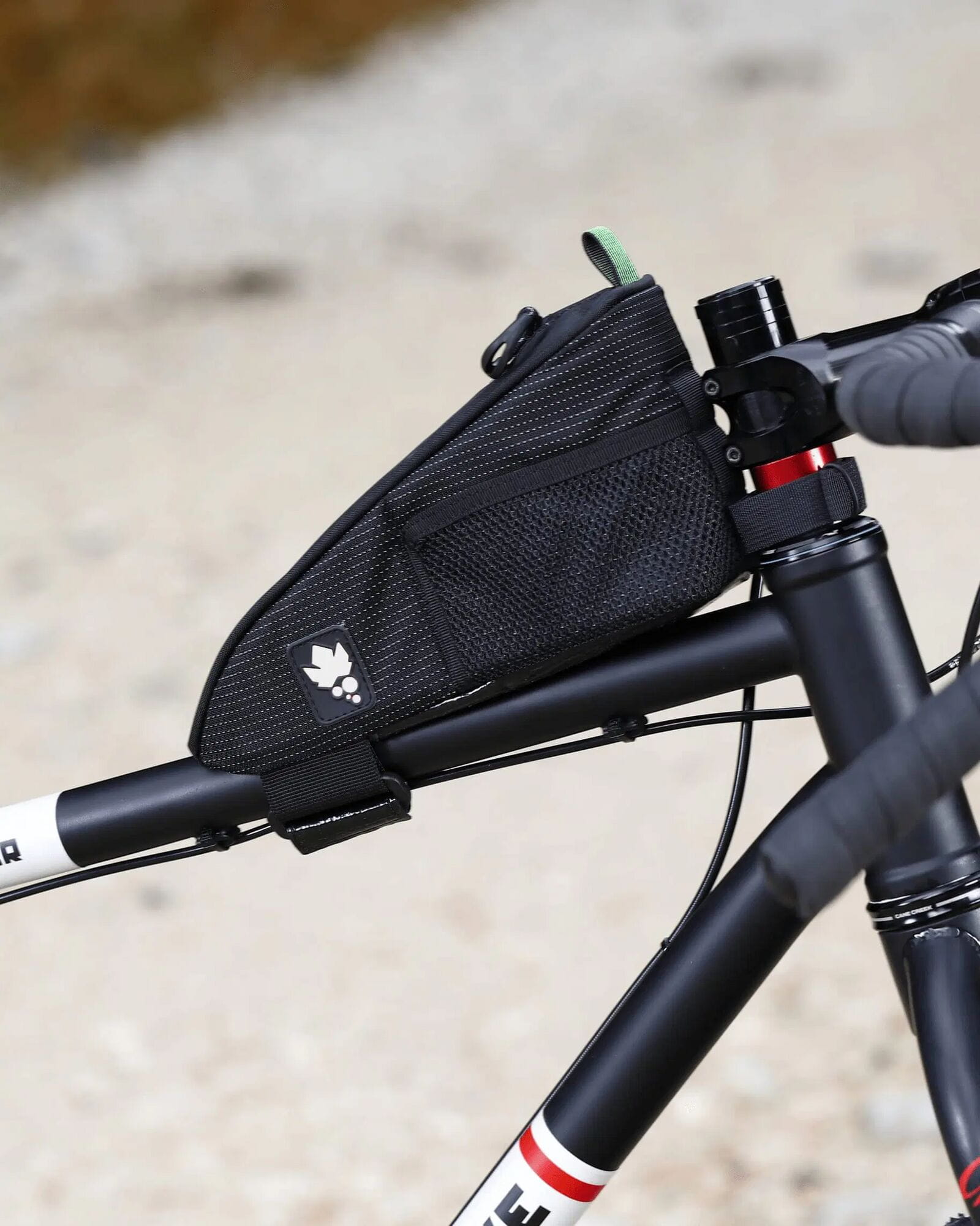 Miss Grape Node Adventure strap-mount top tube bag for cycling storage, compact accessory with secure strap attachment.