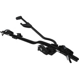 Thule 598 ProRide locking upright bike carrier mounted on roof bars, black color, showcasing secure bike transportation accessory