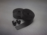 PRO Pursuit Team handlebar tape with gel backing and alloy end caps for cycling, showing the textured black tape on handlebars.