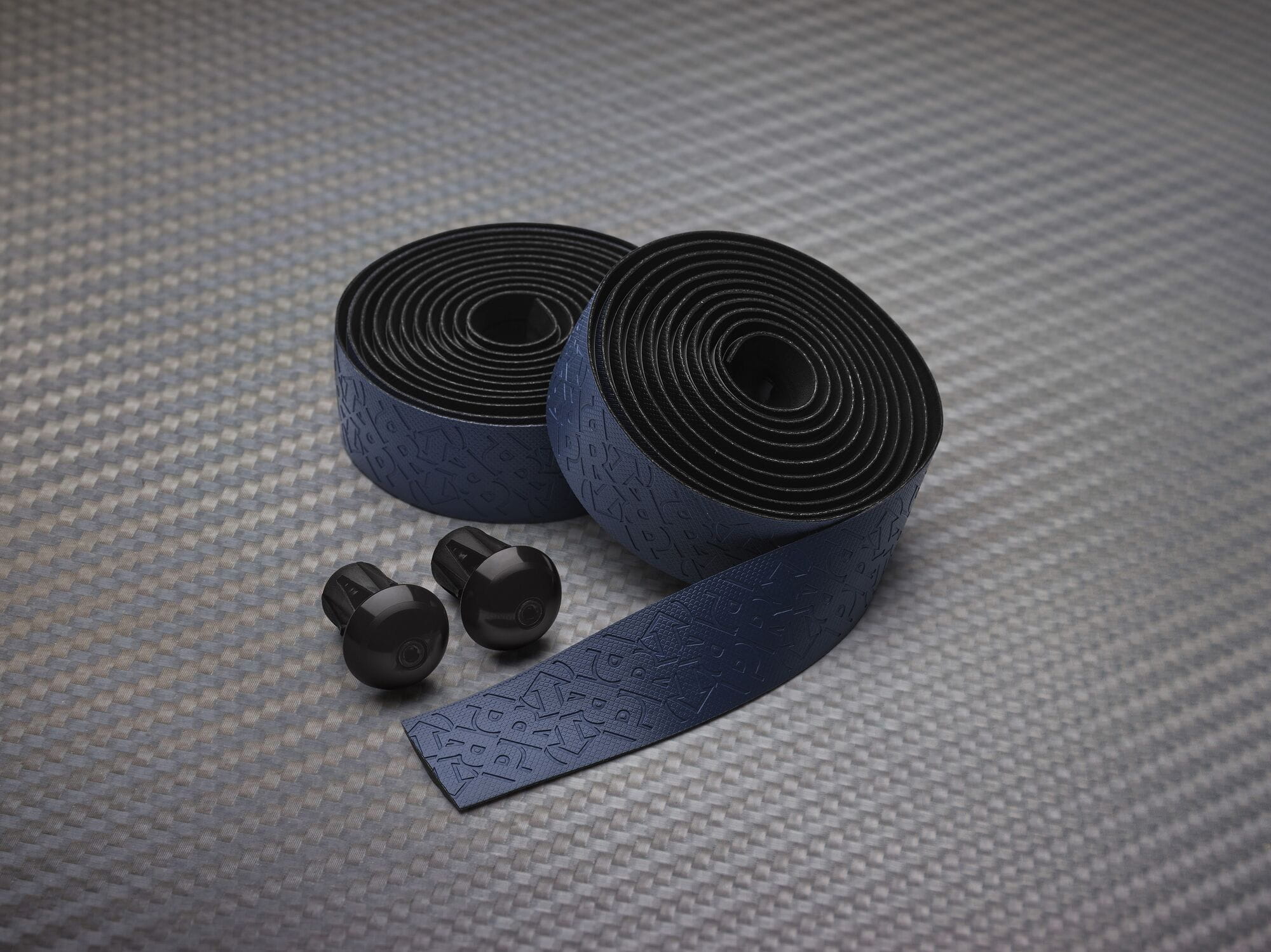 Cycling handlebar tape by PRO with gel backing and alloy end caps, designed for comfortable gripping and bike control.