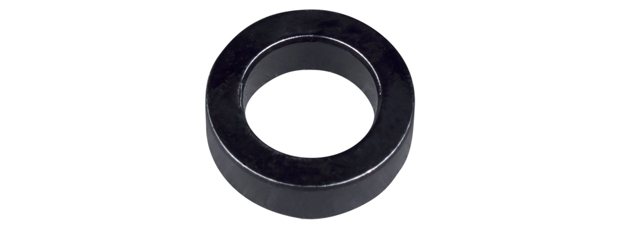 Black Trek shock assembly spacer, 5mm by 10mm, for full-suspension bike frames, component part for suspension setup.