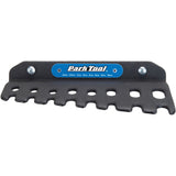 Park Tool T-Handle Hex Wrench Holder mounted on wall, designed for THH-1 set, organized workshop storage for bike tools.