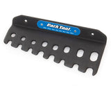 Park Tool T-Handle Hex Wrench Holder mounted on wall, designed for organizing THH-1 hex wrenches in a workshop setting.