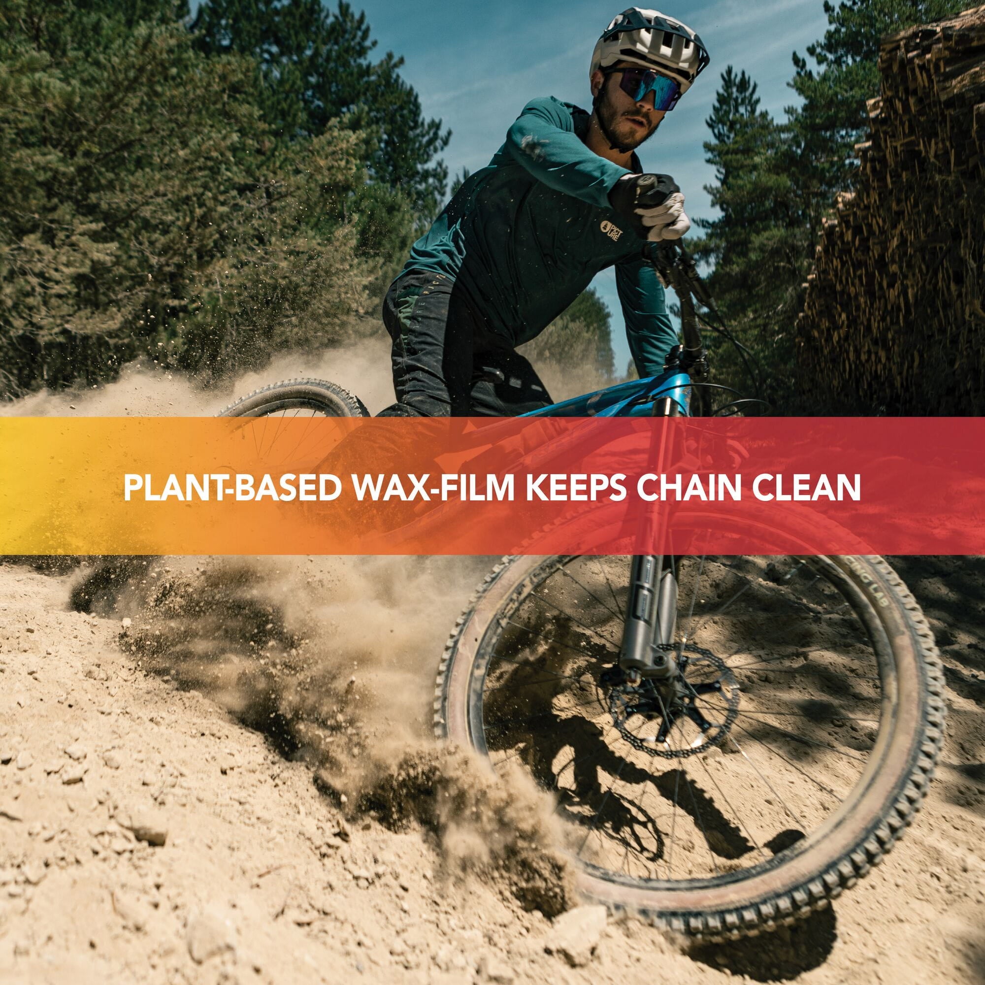 Finish Line BOOSTEDT Bio Wax chain lubricant in a 32oz eco-friendly plant-based bottle, displayed in a workshop setting.