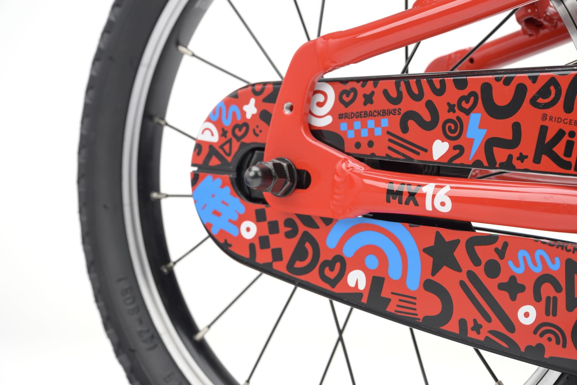 Ridgeback MX16 kids bike with red frame, adjustable 16-inch wheels, suitable for children aged 3.5 to 6 years, close-up detail