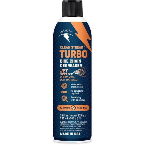 White Lightning Clean Streak Dry Degreaser in a workshop setting, designed for cleaning bike drivetrain and components.