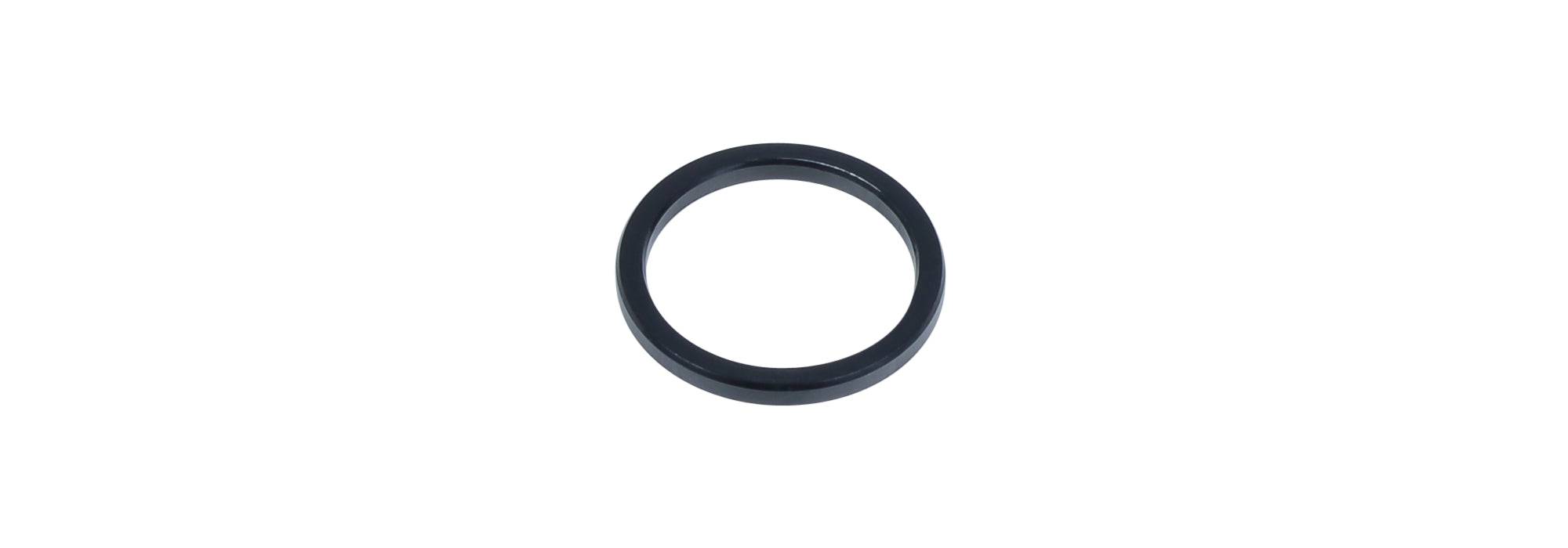Black Trek Top Fuel Rocker Link Pivot Spacer for suspension frame, showcasing the lightweight component in close-up.