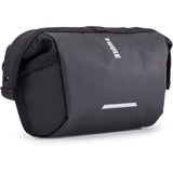 Thule Chasm Handlebar Bag 2L with removable pouch and water-resistant design mounted on a bicycle handlebar.