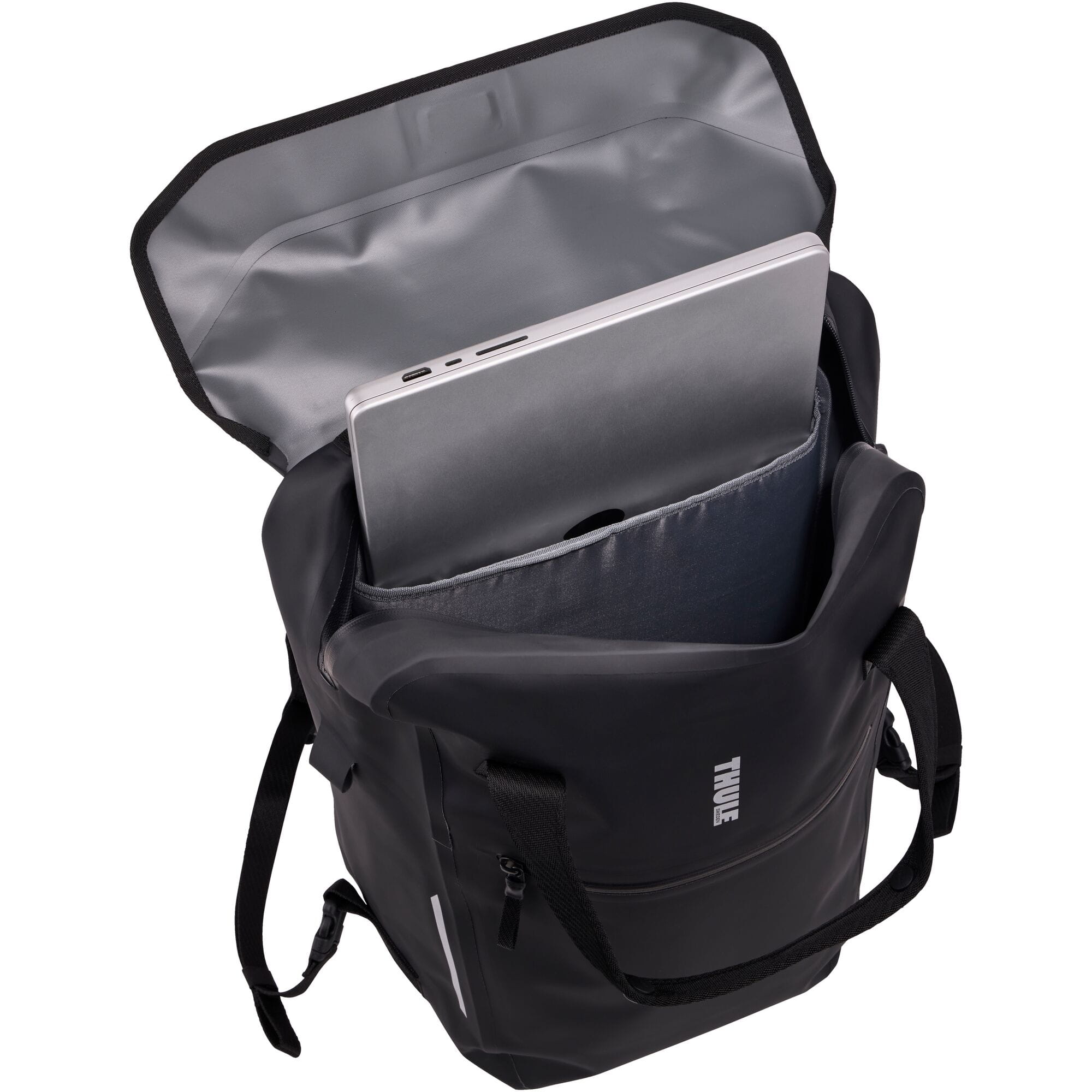 Thule Shield 23L waterproof backpack with InLock bike rack attachment, showing durable black fabric and secure attachment points.