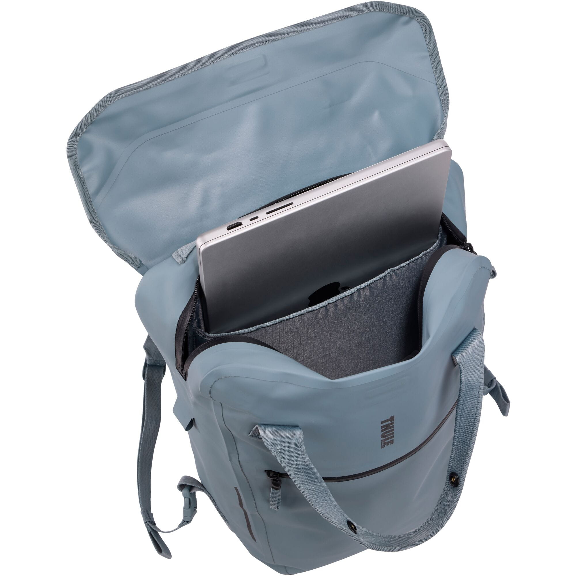 Thule Shield 23L waterproof backpack with InLock bike rack attachment, showing secure straps and durable outdoor gear design.