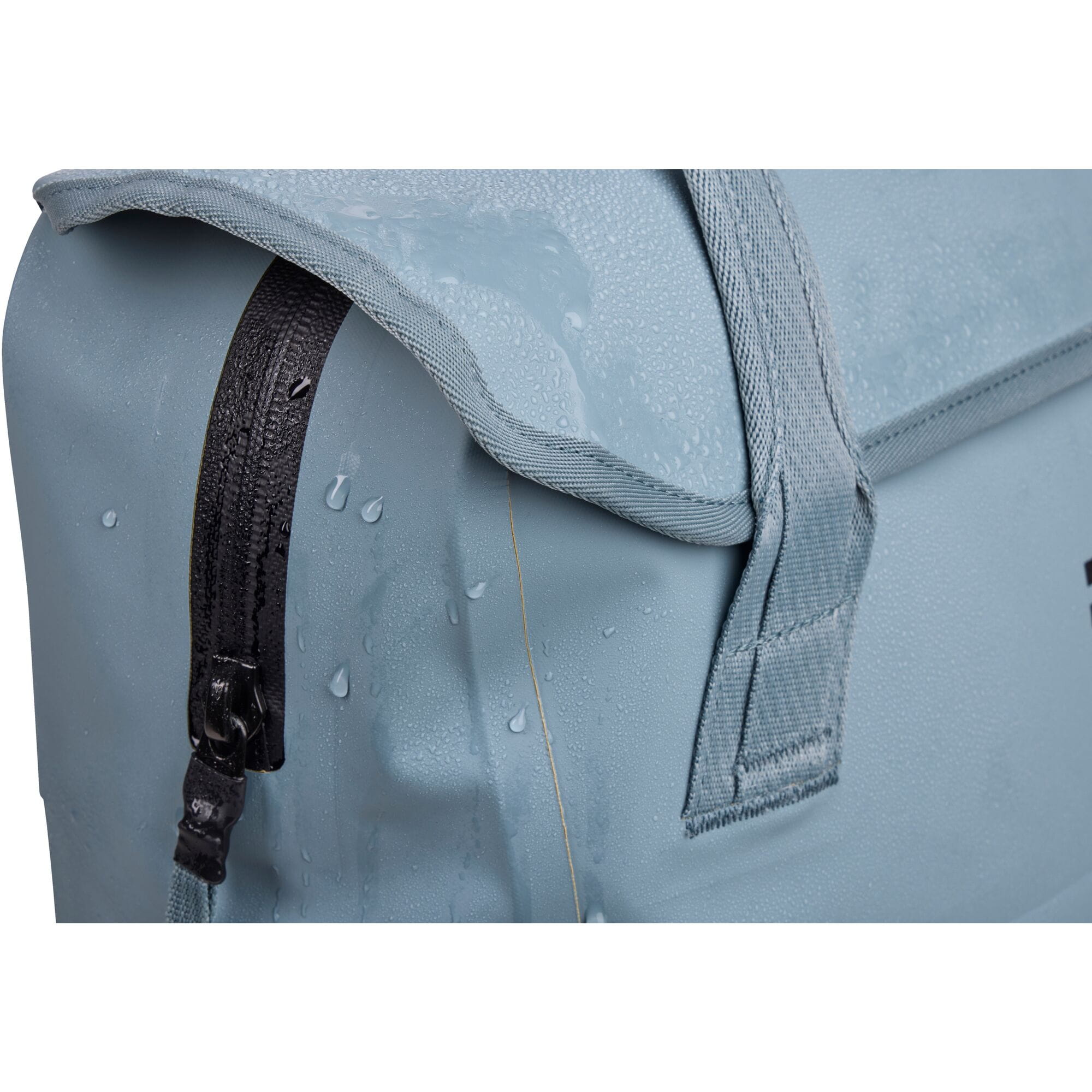 Thule Shield 23L waterproof backpack with InLock bike rack attachment, shown with secure straps and rugged design.
