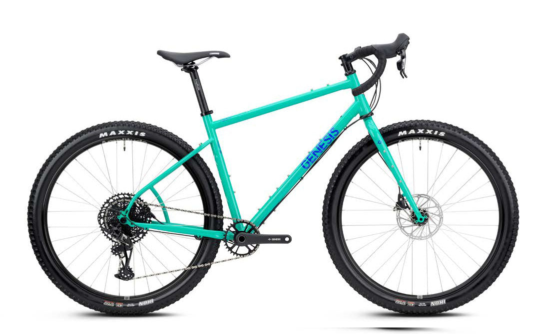 Genesis Vagabond 20 LT gravel bike with 12-speed SRAM Apex XPLR drivetrain, black frame, and knobby tires for off-road riding.