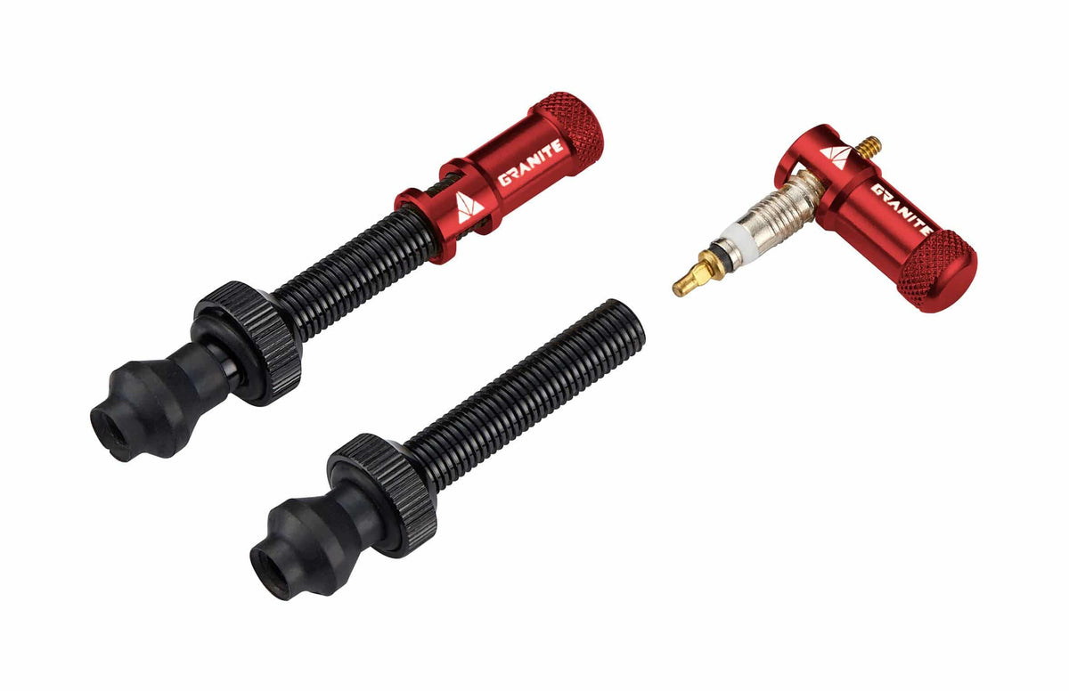 Granite Juicy Nipple valve cap with removal tool and optional valve stem set, showcasing durable components for vehicle tires.